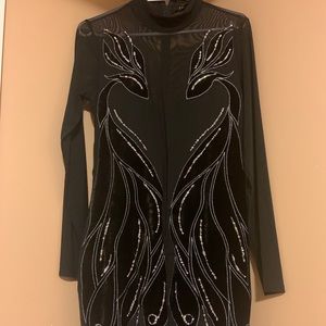 Black turtle neck dress.